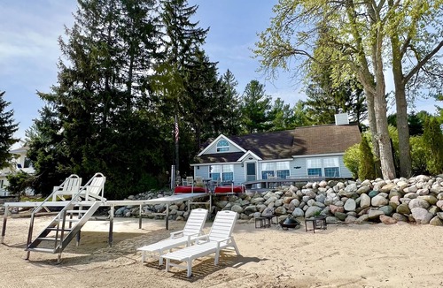 Suttons Bay House | Big Sandy Beach !Walk to Village! Suttons Bay Waterfront Cottage.