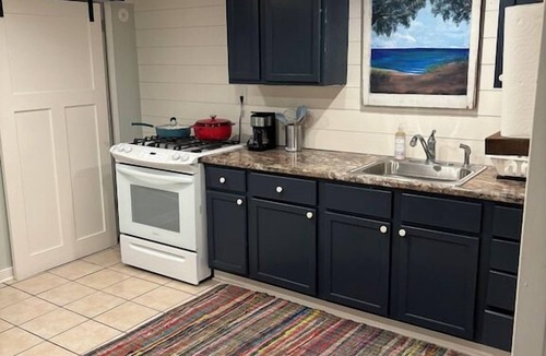 Miller Beach Apartment | Blocks from the beach with giant covered deck, firepit, and grill!