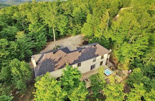 Morin Heights Ski Chalet | Blue Hill Pool spa game room mountain view