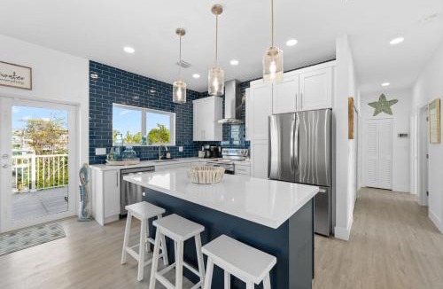 Marathon Villa | Blue Pearl New Waterfront Haven with Heated Pool ,70 Foot Dock, and More!