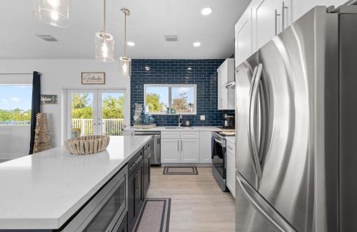 Marathon Villa | Blue Pearl New Waterfront Haven with Heated Pool ,70 Foot Dock, and More!