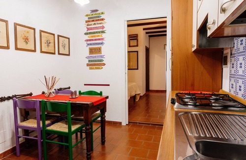 Oliveto Apartment | Borgo 2px apartment: bedroom, kitchen and bathroom.