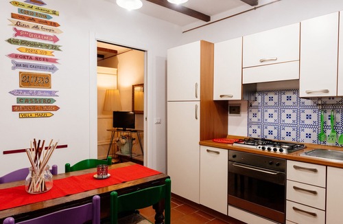 Oliveto Apartment | Borgo 2px apartment: bedroom, kitchen and bathroom.