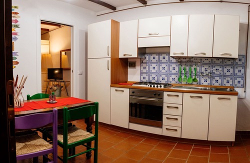 Oliveto Apartment | Borgo 2px apartment: bedroom, kitchen and bathroom.
