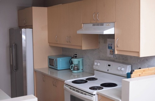 Sunnyside House | Bow River Retreat: Basement Room for Rent
