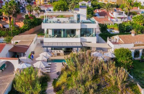 Urbanizacion Costabella Villa | Breath Taking Front Line Beach Villa with Sauna & Jacuzzi