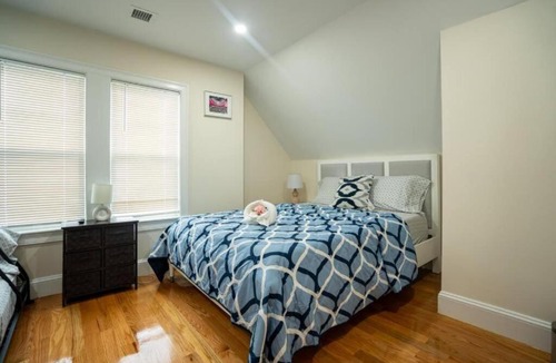 St. Marks Apartment | Breezy 3BR Boston Apt - Bathtub, Parking, TV, Walk to Train 803