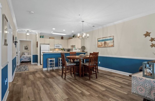 Central Myrtle Beach Condo | Bright and Modern 3BR Family Friendly Condo with pool, golf, Ripken Experience.
