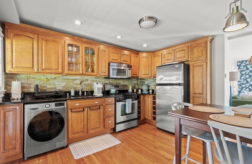 Commercial Street Apartment | Bright and Modern Condo w/Patio, Parking, AC