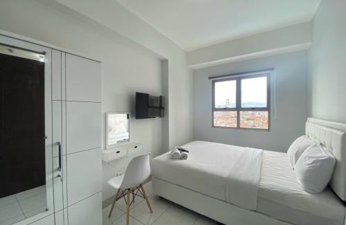 Cibaduyut Apartment | Bright and Relaxing 2BR Apartment at Mekarwangi Square Cibaduyut By Travelio