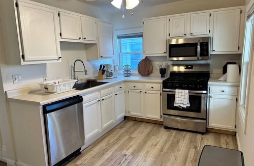 Summit - University House | Bright, chic & spacious by Summit/Hamline in St Paul with porch and swing chairs