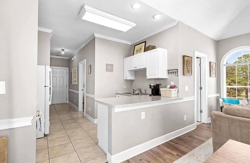 Central Myrtle Beach Apartment | Bright & Cozy Myrtlewood Condo- One Mile to Beach & Broadway with Pools and Golf