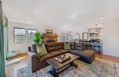 Cambridge House | Bright hilltop retreat with stunning mountain views, wrap-around windows, and cozy seating to take it all in. Nestled on a private, scenic property minutes from charming Cambridge village—perfect for a peaceful getaway year-round.