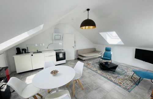 Karthause Condo | Bright, spacious attic apartment.