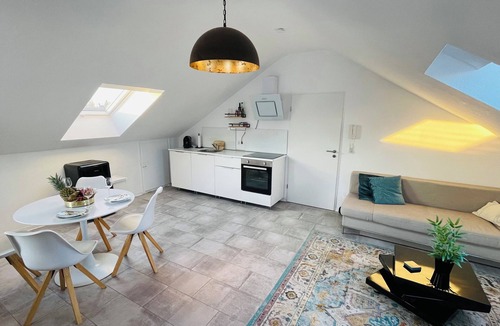 Karthause Condo | Bright, spacious attic apartment.