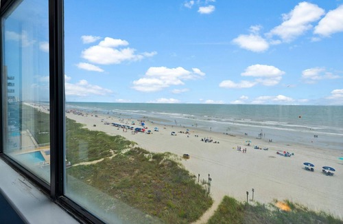Crescent Beach Condo | Brightly colored oceanfront two-bedroom unit | Carolina Reef - 507