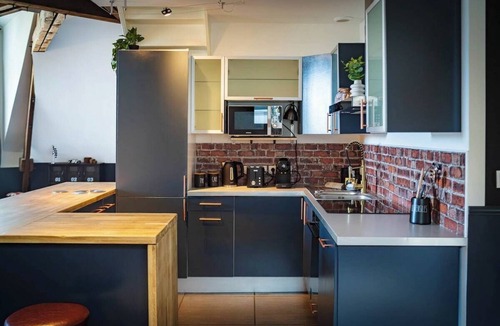Republique Apartment | British Style, projector, foosball & right in the heart of downtown