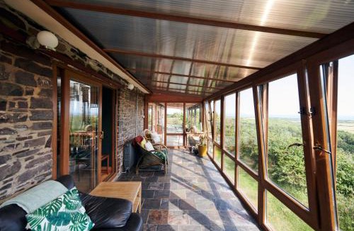 Llanybri House | Brofallen - Spacious bunglaow with distant sea views and enclosed garden