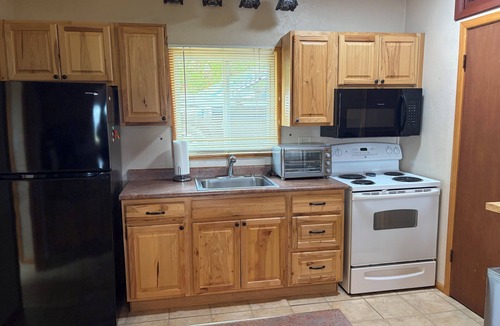 Palmer Lake House | Built in 1908 this historic cabin is full of original charm with a penthouse view. Step inside and you are immediately greeted by a full unobstructed view of Elephant Rock. Sleeping up to 9 people.
