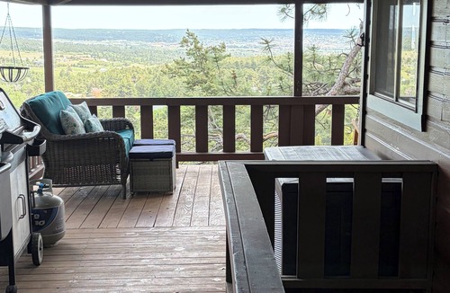 Palmer Lake House | Built in 1908 this historic cabin is full of original charm with a penthouse view. Step inside and you are immediately greeted by a full unobstructed view of Elephant Rock. Sleeping up to 9 people.