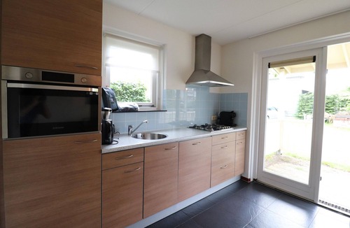 Bernisse House | Bungalow by Water with Sauna in South Holland