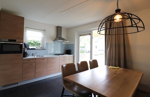 Bernisse House | Bungalow by Water with Sauna in South Holland