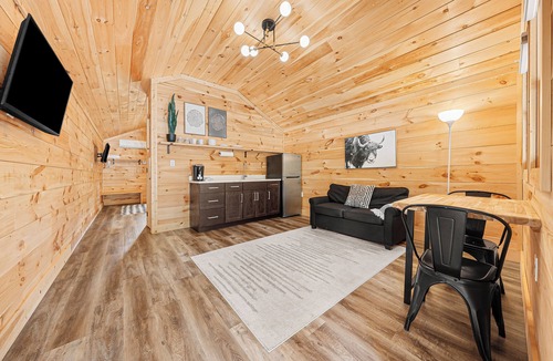 Hartwell RV Rental | Cabin #7: One king-size bed, a kitchenette, and a large gravel parking pad beside the cabin for easy boat or trailer storage.