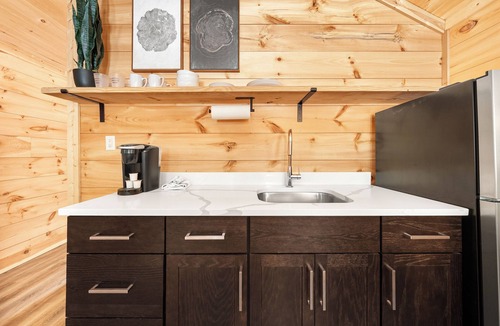 Hartwell RV Rental | Cabin #7: One king-size bed, a kitchenette, and a large gravel parking pad beside the cabin for easy boat or trailer storage.