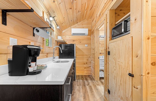 Hartwell RV Rental | Cabin #8: Studio style layout with kitchenette and a large gravel parking pad beside the cabin for easy boat or trailer storage.