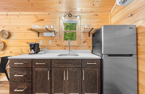 Hartwell RV Rental | Cabin #8: Studio style layout with kitchenette and a large gravel parking pad beside the cabin for easy boat or trailer storage.
