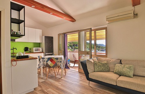 Seccheto Apartment | Camilla, a two-room apartment in Seccheto with a splendid sea view, a small balcony equipped with ch
