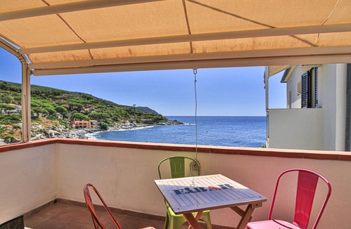 Seccheto Apartment | Camilla, a two-room apartment in Seccheto with a splendid sea view, a small balcony equipped with ch