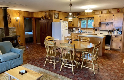 Rangeley Plantation House | Camp Chuck-a-luck | Private Beach, Dock, Kayaks | Dog-Friendly Mooselookmeguntic Lake Cabin