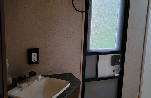 La Pointe RV Rental | Camp in style with AC/heat, WIFI, on Main Street, 1 block from Joni's beach