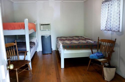 Branson House | Camper Cabin Escape with Fire Pit and Covered Porch in Branson, Missouri