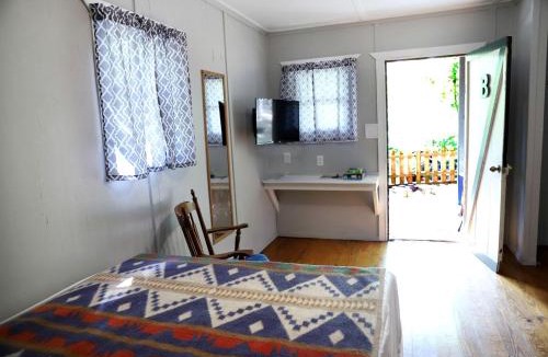 Branson House | Camper Cabin Escape with Fire Pit and Covered Porch in Branson, Missouri