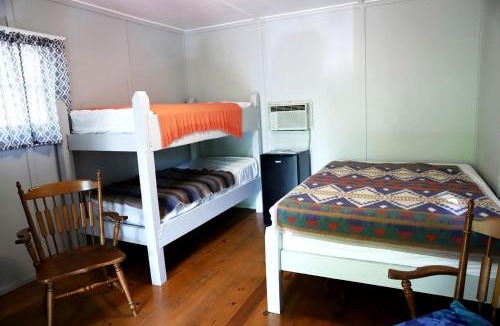 Branson House | Camper Cabin Escape with Fire Pit and Covered Porch in Branson, Missouri