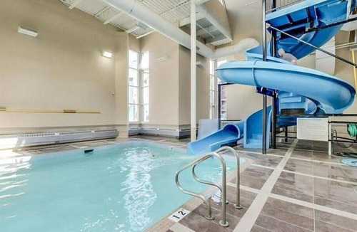 Canmore Apartment | Canmore Mountain Retreat. Hot Tub, Pool, King Bed!