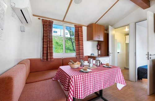 Pettenasco RV Rental | Caravan 'Mobile Home Comfort Standard' with Lake View, Shared Pool and Wi-Fi