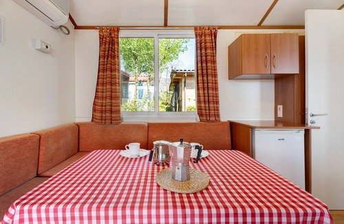 Pratolungo RV Rental | Caravan 'Mobile Home Comfort Vista Lago' with Lake View, Shared Pool and Private Garden