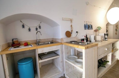 Oia Apartment | Casa Itaca Fireplace Cave Apartment with Private Jacuzzi in Oia, Finikia