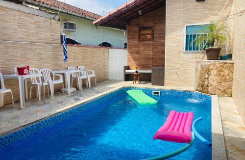 Real Villa | Casa Moderna e Aconchegante à Beira Mar, com Opção de Piscina Aquecida Cobrado à Parte, Área Gourmet com Churrasqueira em Deck Coberto Frente a Piscina, Aconchegante Sala de Estar com Lareira, Garagem para 4 Carros, Casa Pé na Areia a 50 metros da Praia