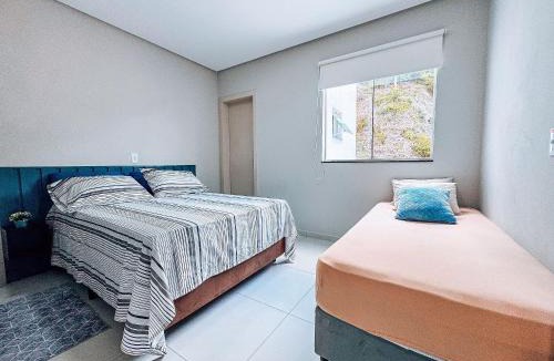 Nova Brasilia House | Casa Nova e Completa | 2 Suítes com Ar | Área Gourmet | 2 Vagas