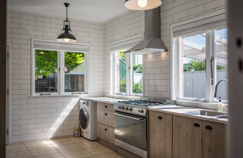 Papatoetoe House | Castle Charm with Modern Interiors– Steps to Shops