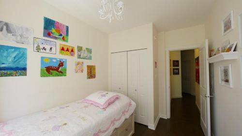 Central Lonsdale Apartment | Central and quiet 2 bedroom townhouse with private patio, parking, gym