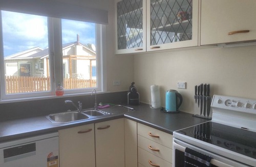 Waitarere Beach House | Central and spacious Waitarere Beach 3 Bed, 2 Bathroom house with sea views