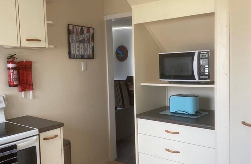 Waitarere Beach House | Central and spacious Waitarere Beach 3 Bed, 2 Bathroom house with sea views