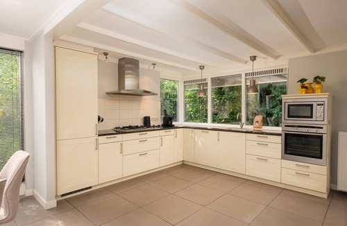Lieren House | Central luxury group villa with hot tub, five bedrooms, large kitchen, and enclosed garden. Plenty of privacy and comfort inside and out.