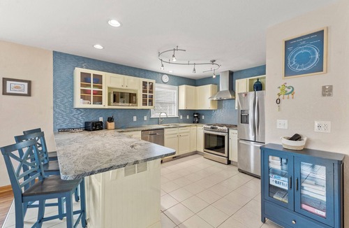 Colington Harbour House | CH73: Coastal Kaleidoscope water view home with boat dock close to beach