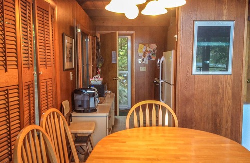 Meredith Cottage | Chalet-style lakefront home with private dock, beach, kayak, canoe & epic view